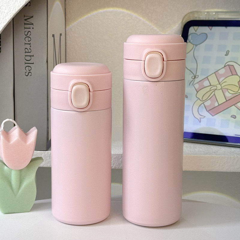 Kompakt isolert drikkeflaske (320ml) for kvinner, lekkasjesikker og holdbar, i stilig rosa design.