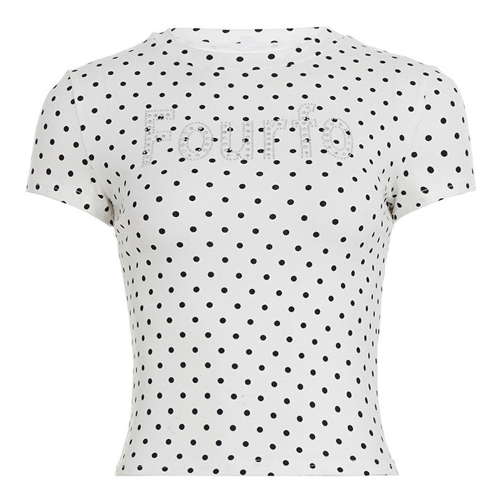 Trendy kortsleev topp til dame i mykt stoff, med prikker og glittereffekt. Moderne stil for enhver anledning.