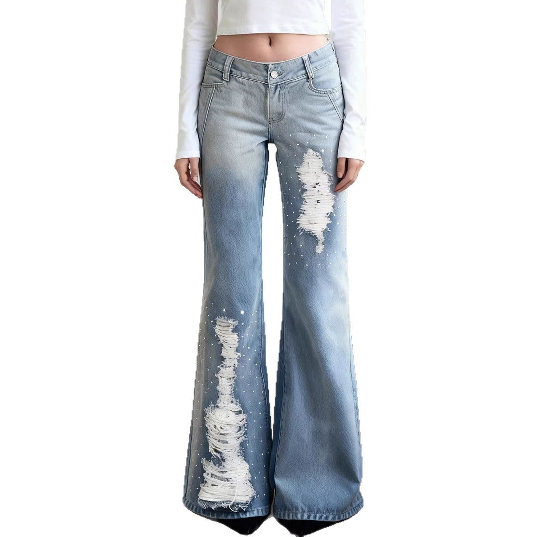 Dame slagjeans med trendy revne detaljer. Komfortable fritidsbukser for en moteriktig stil.