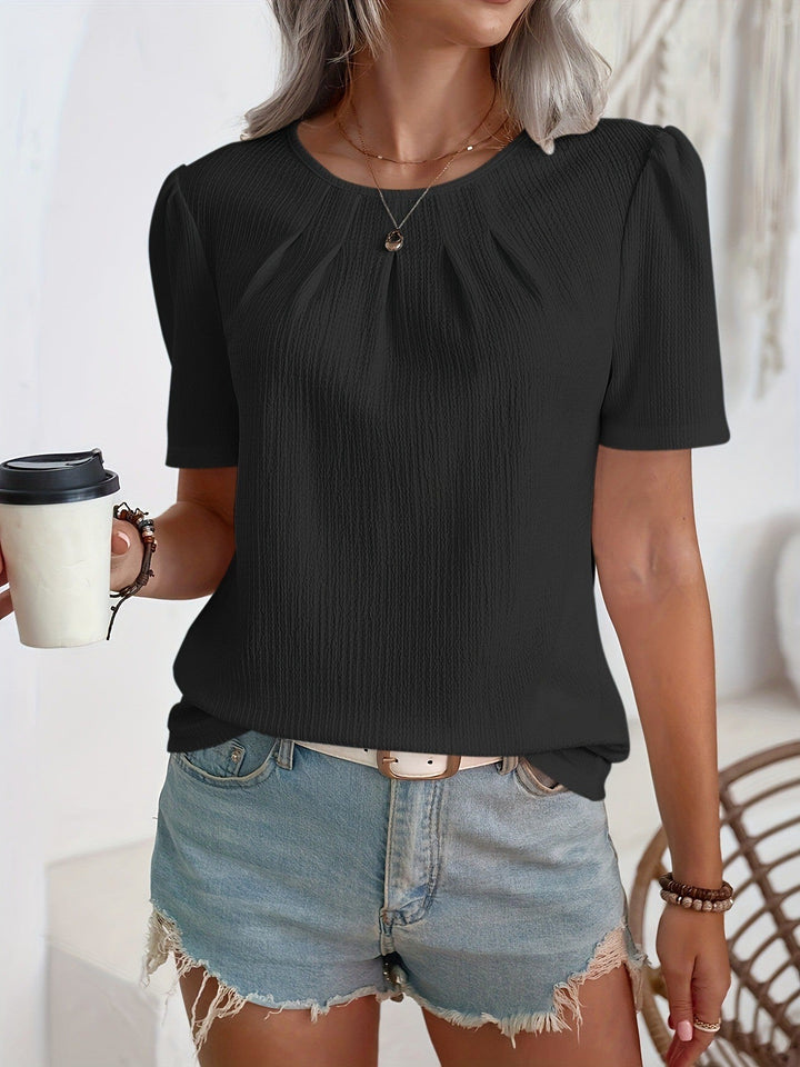 Mote-bluse for kvinner med detaljert struktur og stilige puffermer, ideell for damemote.