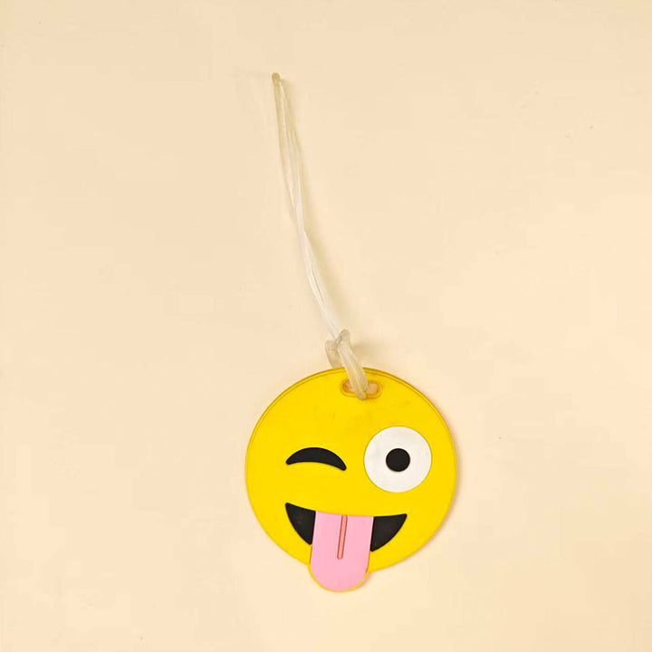 Gjenkjenn din koffert raskt med denne fargerike emoji bagasjelappen i myk silikon.