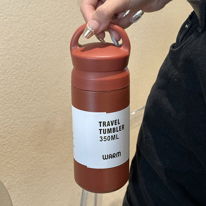 Stilren stål termokopp, 350ml, med ergonomisk design for kvinner. Ideell isolasjonskopp for drikke på farten.