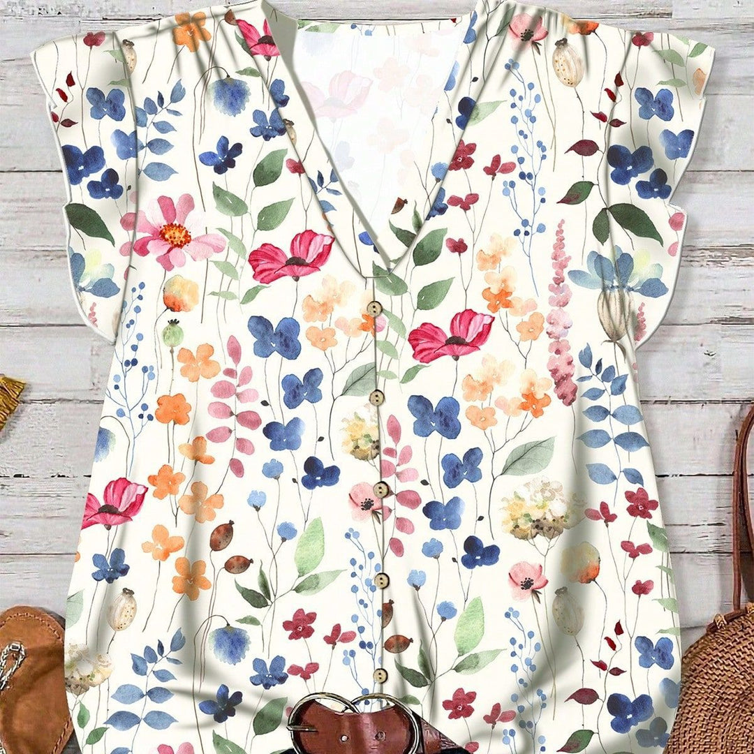 Vår-/sommerbluse i lett stoff med nydelig blomsterdesign og stilig V-hals for damer.