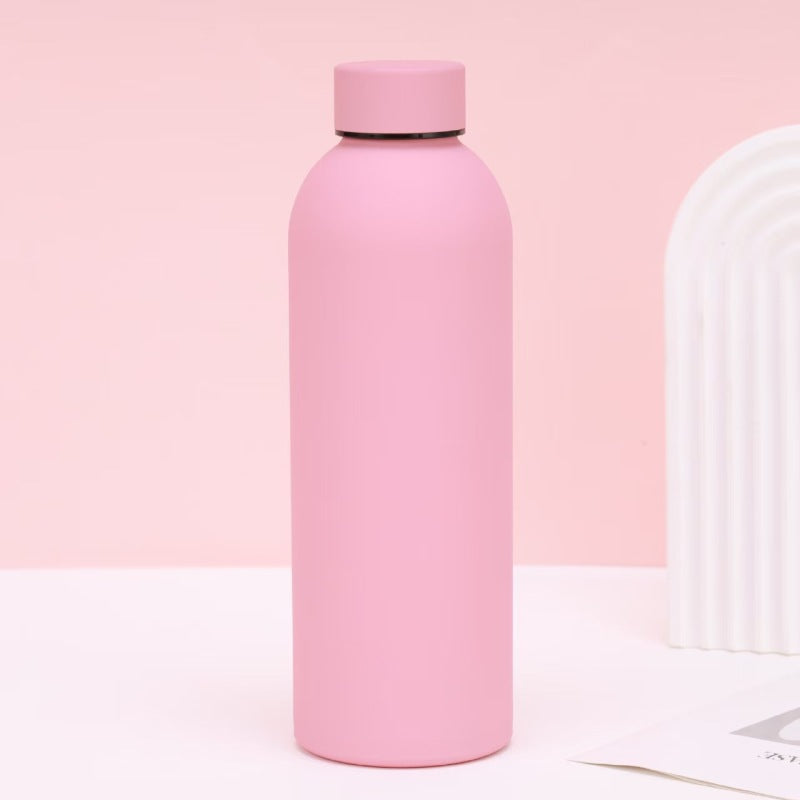 Slank 500ml termoflaske for dame, laget av rustfritt stål med smilende design. Ideell reiseflaske.