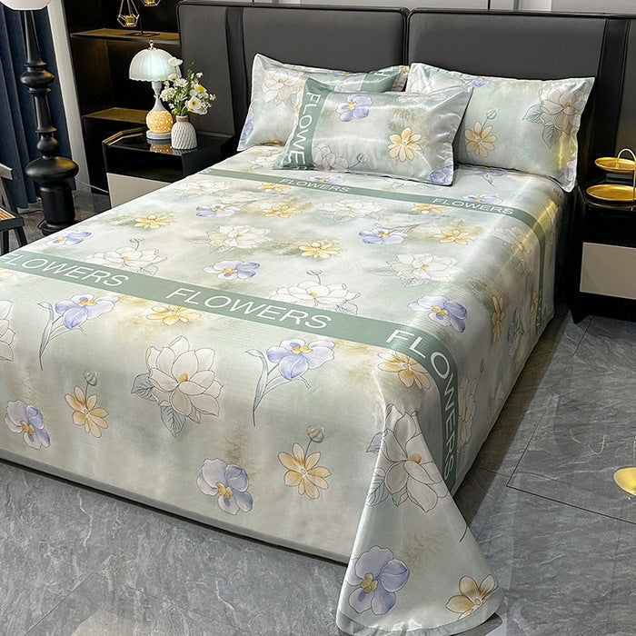 Luksuriøst sengeteppe med elegant blomsterdesign, perfekt for et stilfullt soverom og hjemmeinnredning.