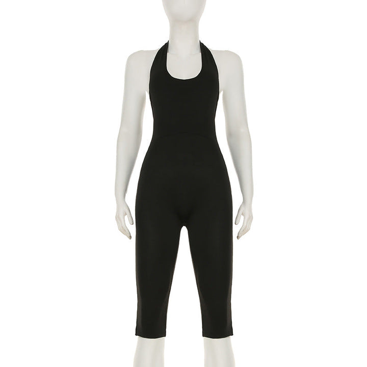Svart kroppsnær damejumpsuit med elegant ryggutskjæring, perfekt for fest og sommer.