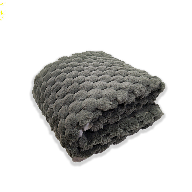 Elegant grått fleece teppe med myk tekstur og bikubemønster. Varmt koseteppe for dame, ideelt for avslapning.