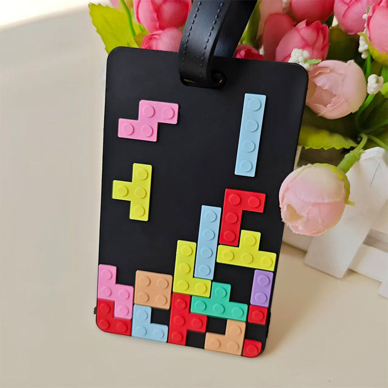 Robust silikon bagasjetag for reise, med lekent Tetris-design som gir kofferten et personlig preg.