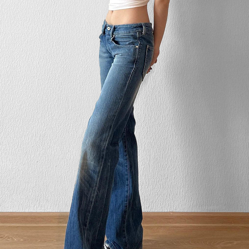 Flared blå denim damejeans med høy midje. Trendy bootcut stil med distressed detaljer. Ideell for hverdagsbruk.