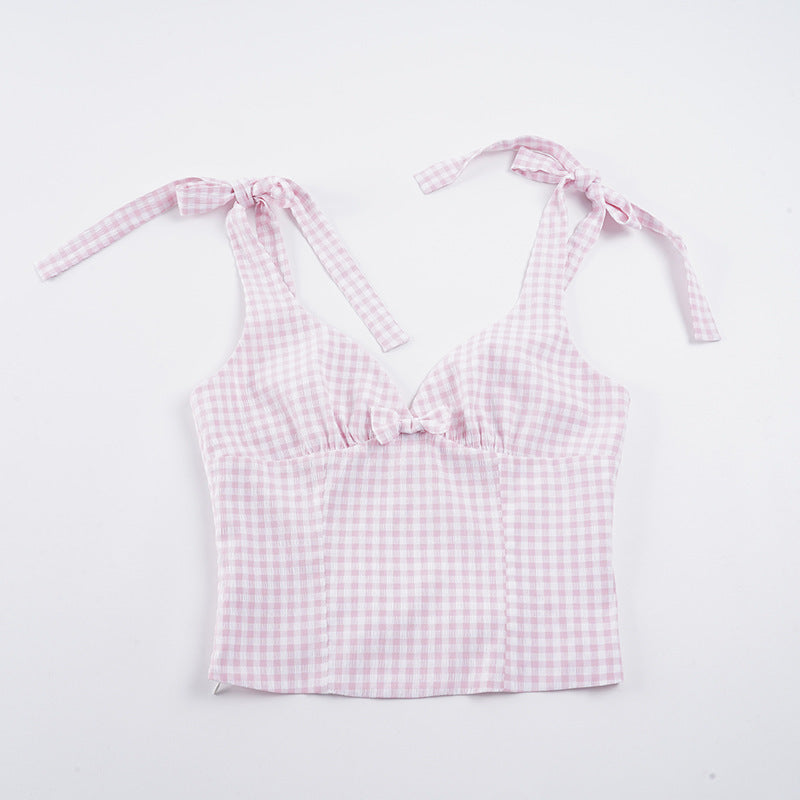 Trendy dame topp med V-hals og lekkert rutemønster. Knyttedetaljer gir et unikt og elegant preg.