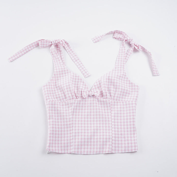 Trendy dame topp med V-hals og lekkert rutemønster. Knyttedetaljer gir et unikt og elegant preg.