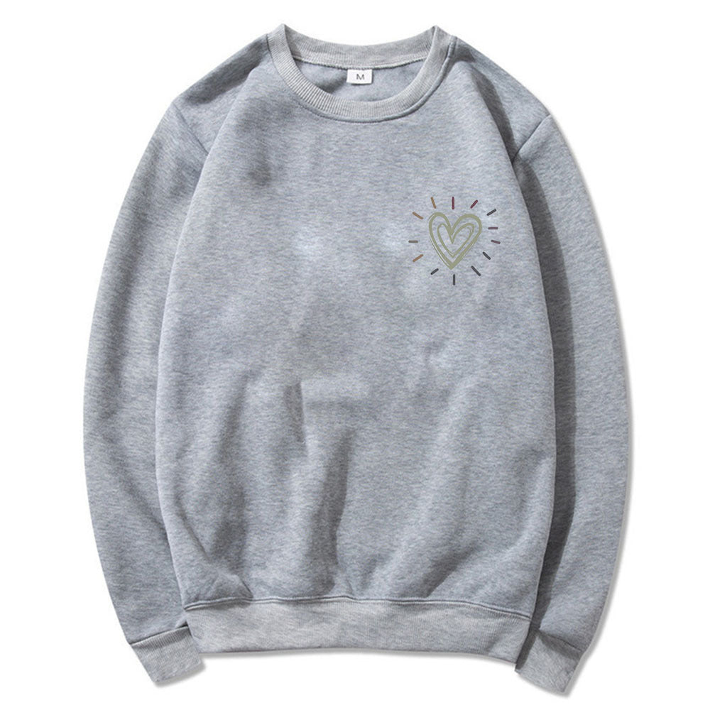 Vår- og høstgenser: Oversized sweatshirt med hjerter. Avslappet og komfortabel stil for damer.