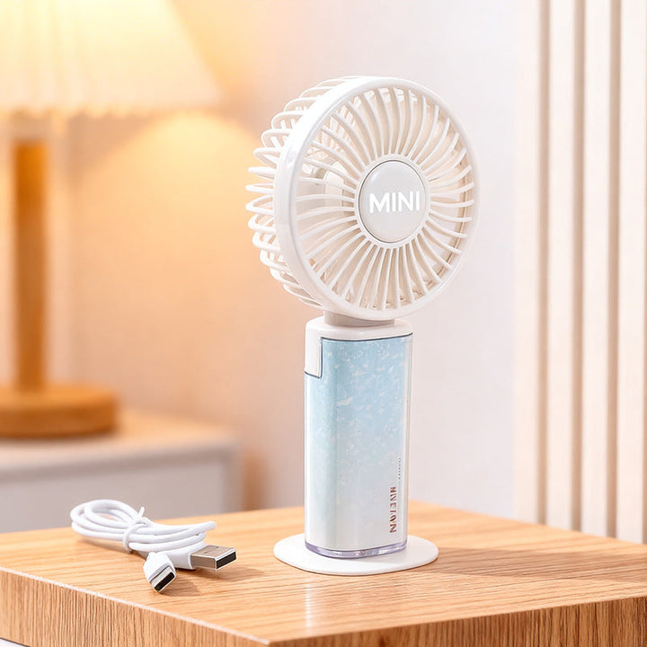 Essensiell sommergadget: en bærbar minivifte som gir lettelse fra varmen, perfekt for festival.