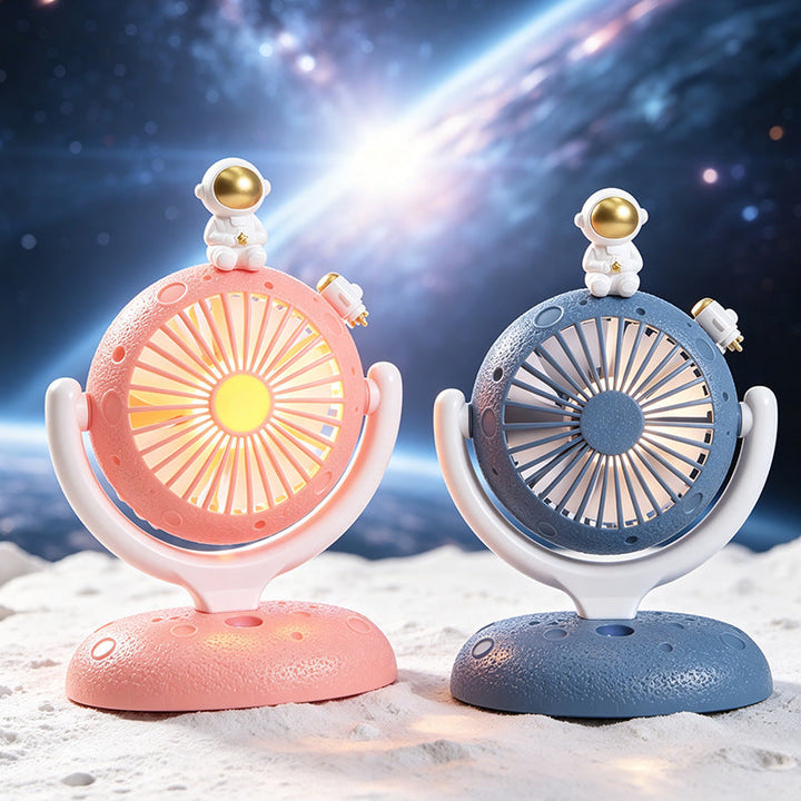 Kompakt skrivebordsvifte med sjarmerende astronautfigur. Rosa designvifte for effektiv og stillegående luftsirkulasjon.