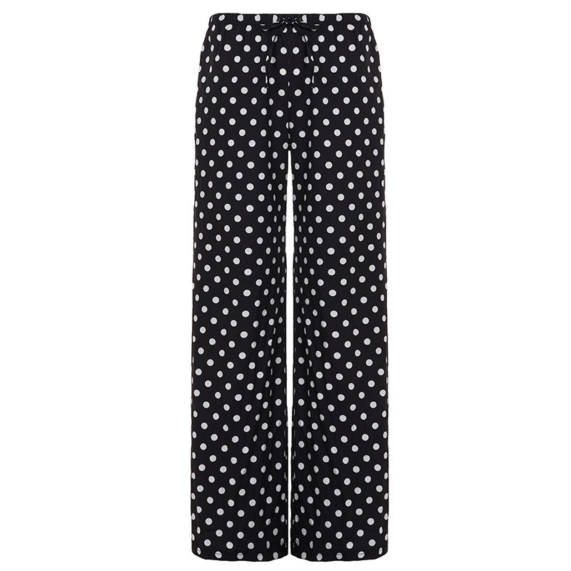 Polka prikker vide bukser for damer. Komfortabel passform med elastisk midje, stilig for både vår og sommer.