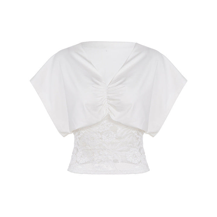 Mote dametopp med elegant V-hals og subtile rynker. Tilgjengelig i flere ensfargede varianter for en chic stil.
