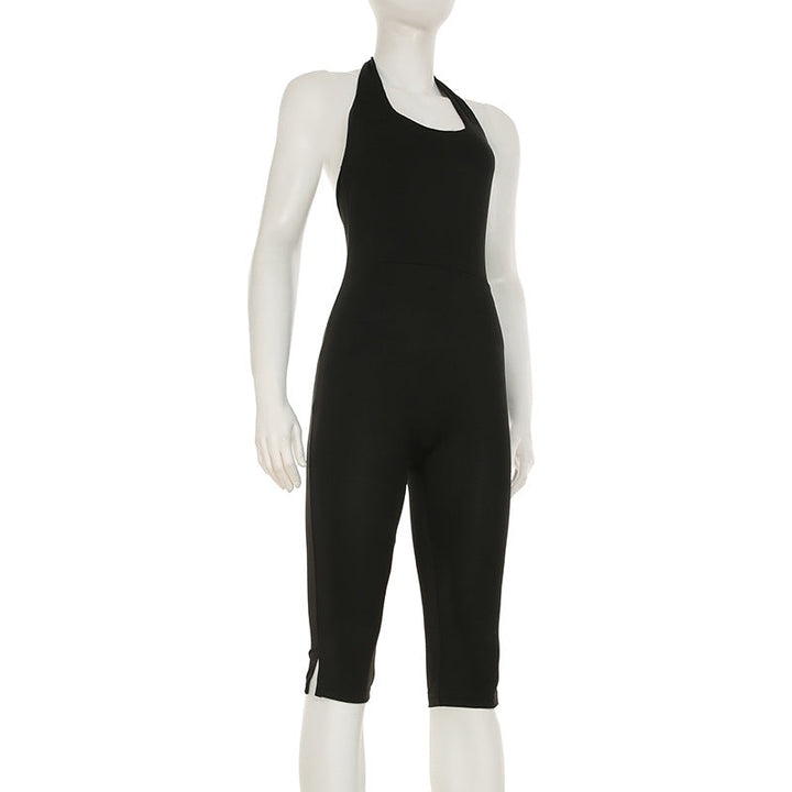 Elegant svart damejumpsuit med kroppsnær passform og dyp ryggutskjæring, ideell for fest og mote.