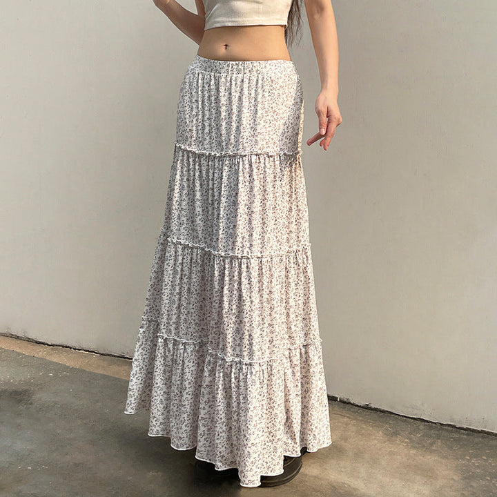 Luftig dame maxiskjørt med blomsterprint og volanger, elastisk midje. Behagelig for sommer & vår.