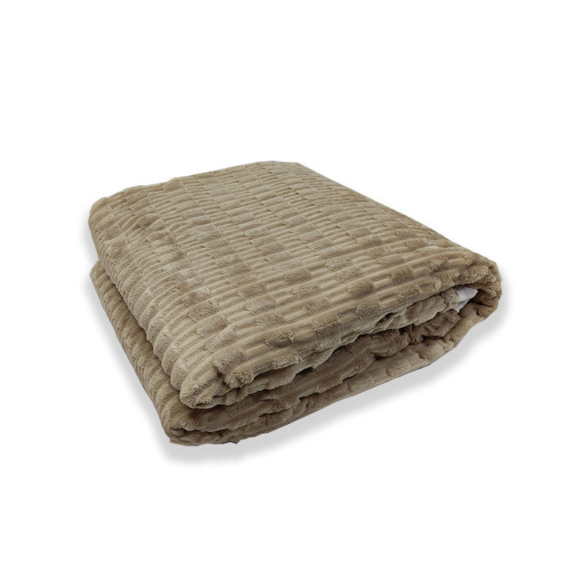 Stable med fargerike myke fleece tepper i blå, grå og beige, ideelle for interiør og komfort.