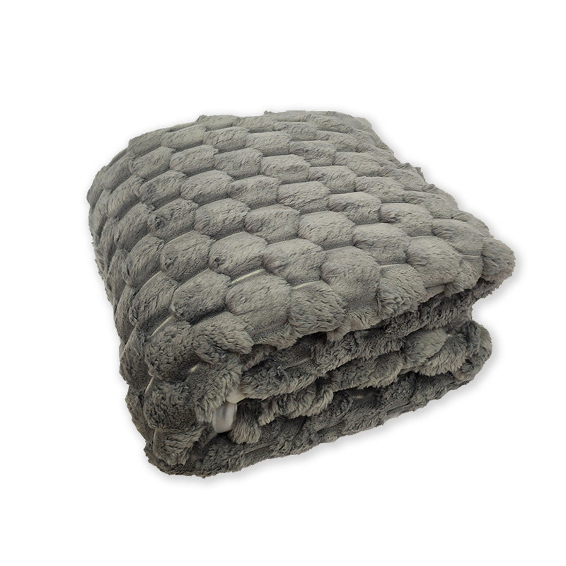 Elegant damepledd i fleece med 3D-struktur. Ideelt sofateppe for stilfull hjemmedekor og hygge.