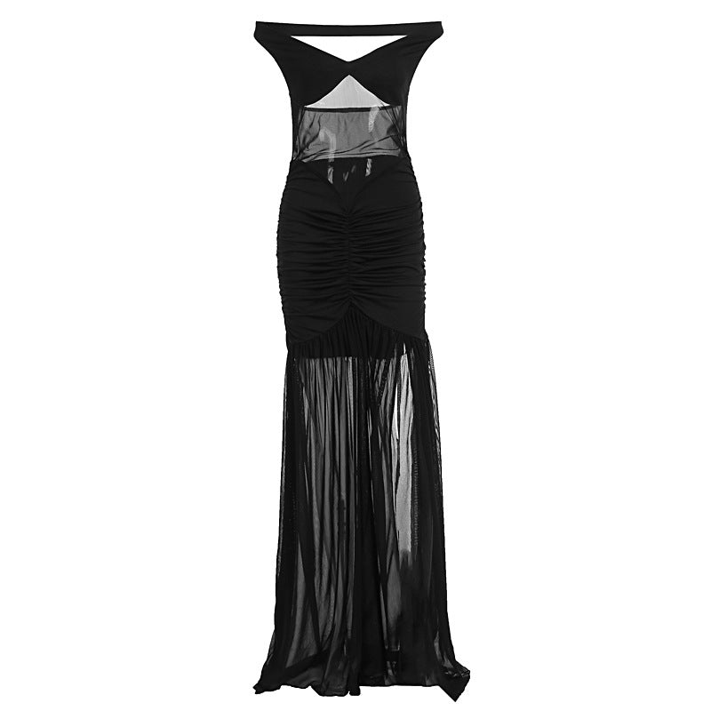 Vakker grønn maxikjole med elegante transparente ermer og figurnær passform, ideell for sommerfest.