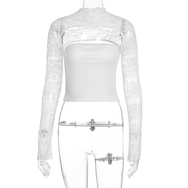 Svart, elegant dametopp med gjennombrutte blondedetaljer og luftige, gjennomsiktige ermer.