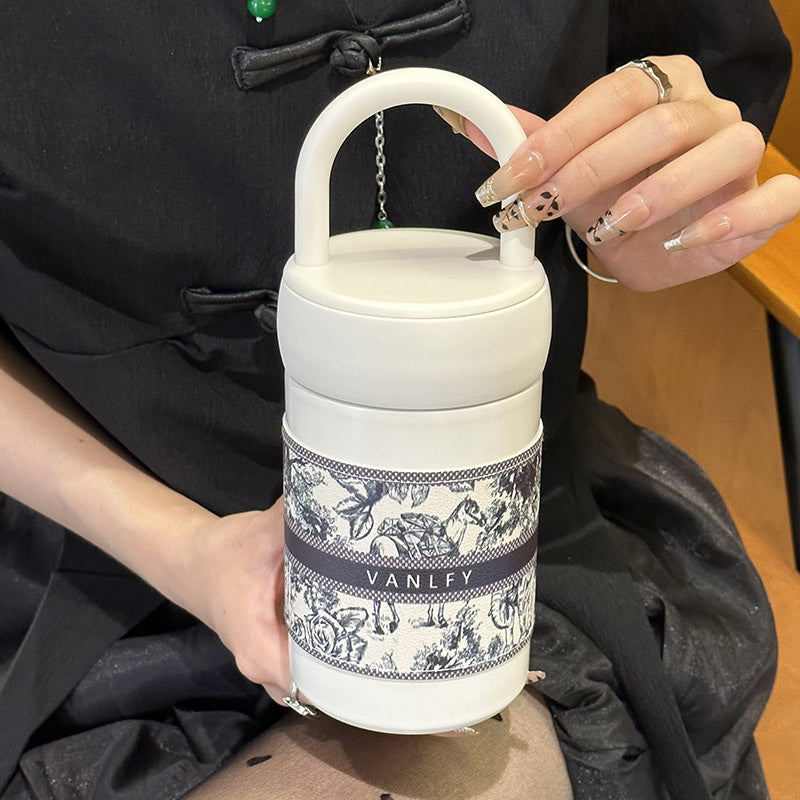 Dame termokopp, stilfull design og håndtak. Ideell isolert kopp for kaffe, te, pendling, kontor.