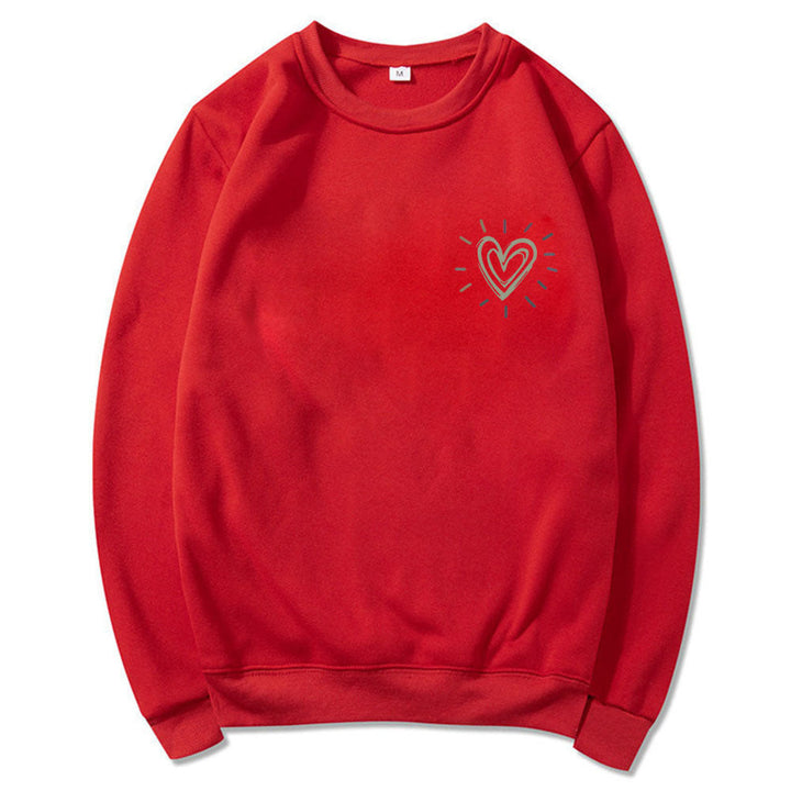 Trendy og basic oversized damegenser med søtt hjerte. En moderne genser for våren.