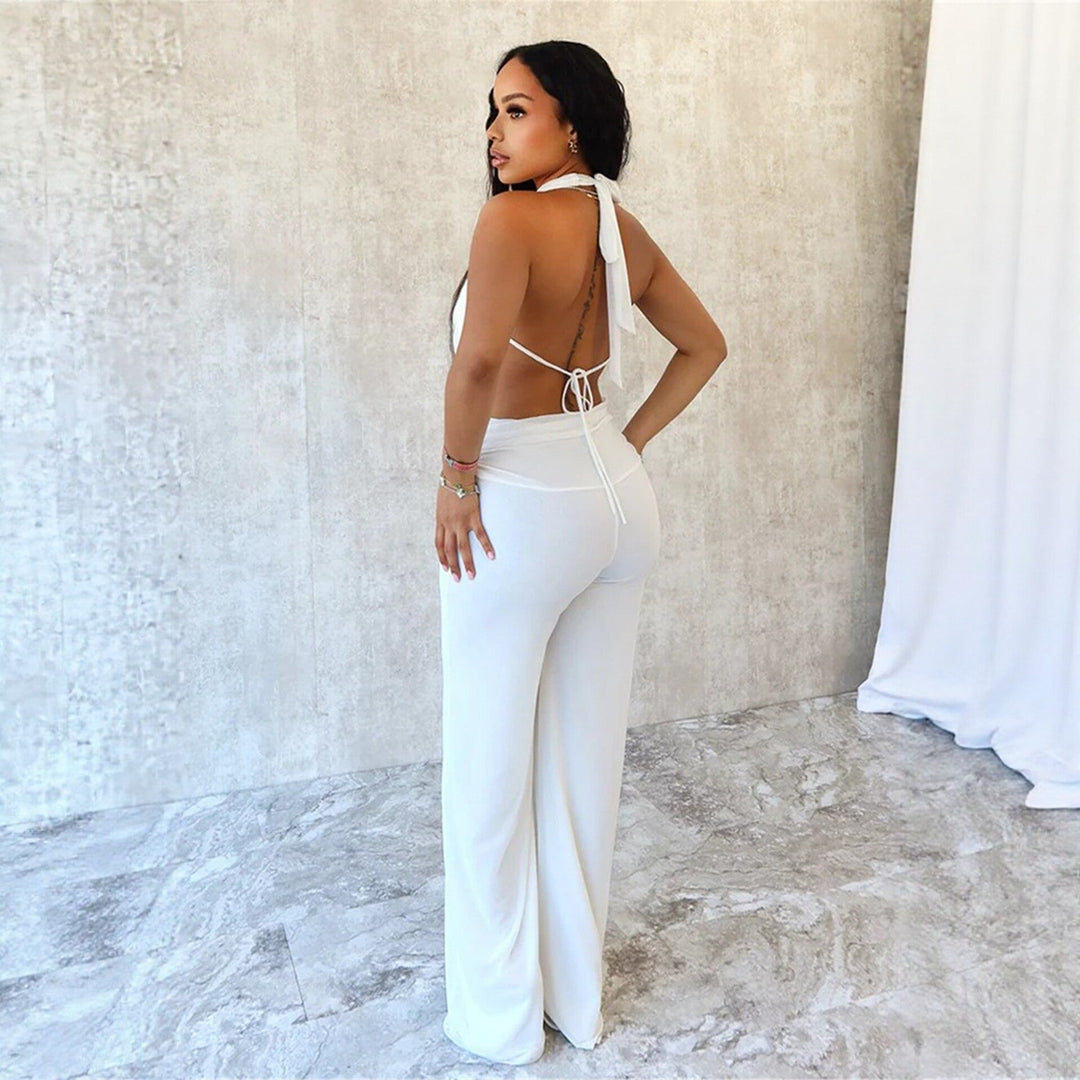 Svart dame jumpsuit med elegant v-hals og vide ben, ideell for formelle kvelder og fest.