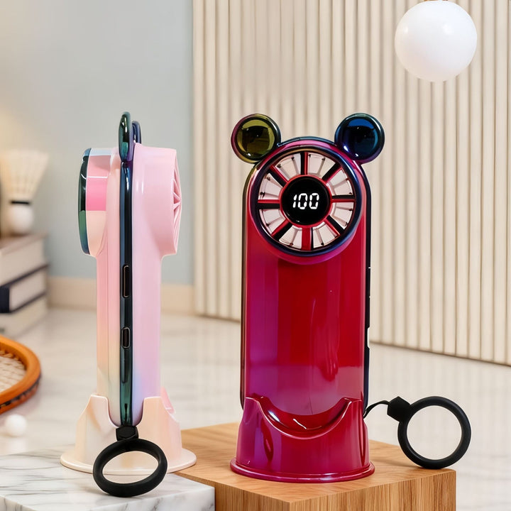 Digital håndvifte med temperaturvisning og søtt design, gir effektiv kjøling for dame på varme sommerdager.