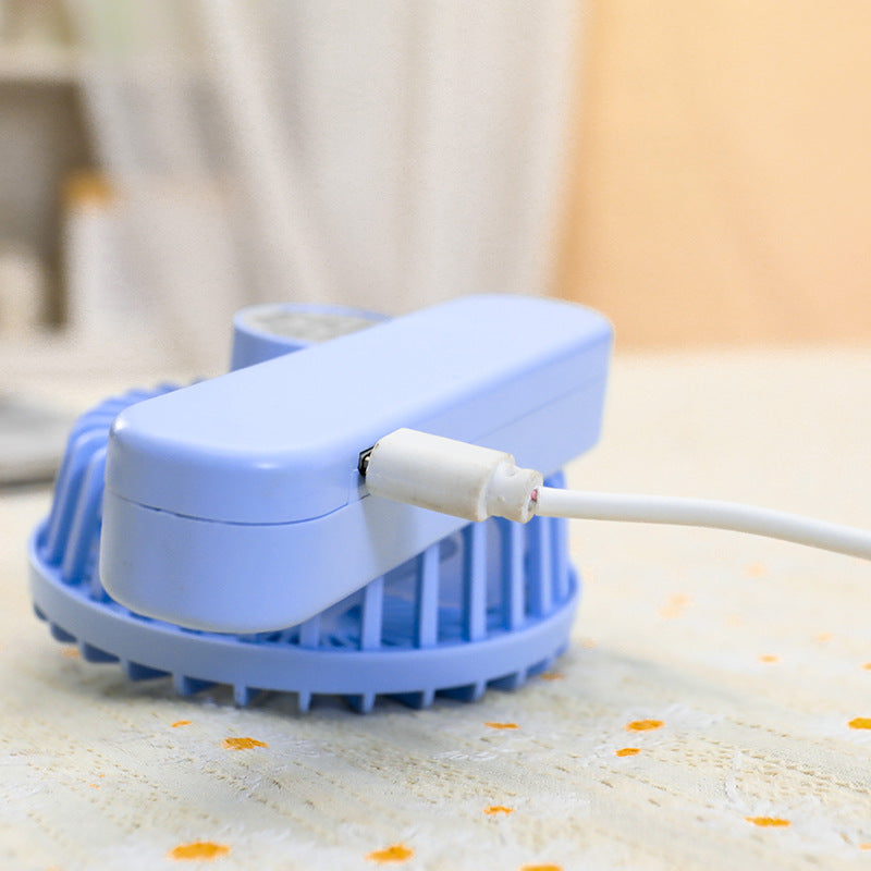 Kompakt bærbar USB vifte, stille og effektiv for kontor, hjemme eller utendørs. Ergonomisk grep for komfort.