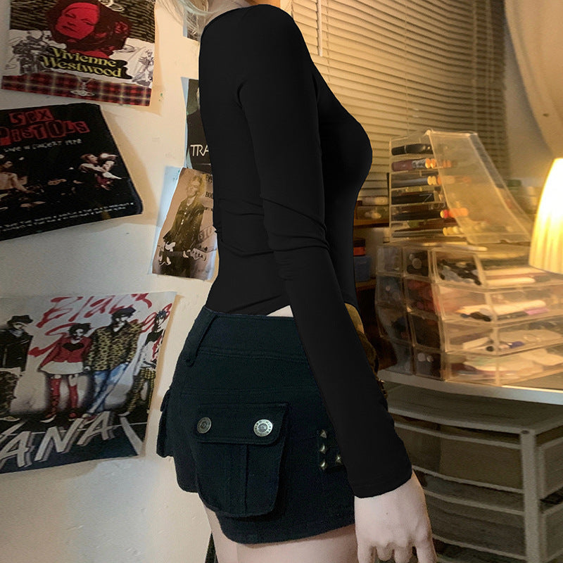 Svart langermet damebodysuit stylet for kontoret, elegant og profesjonell. Kan også brukes til fest.