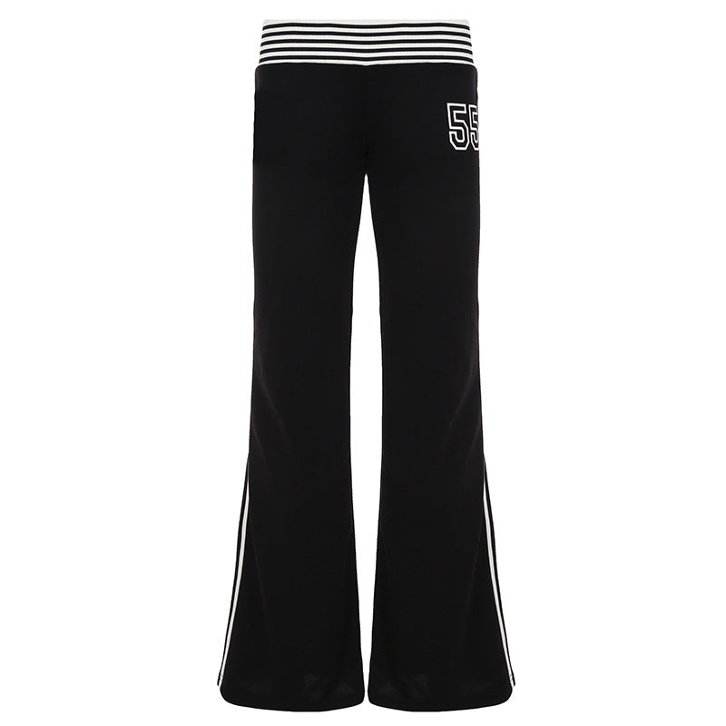 Flared joggebukse dame, svart med hvite sidestriper. Elegant, sporty fritidsbukse for vår og sommer.
