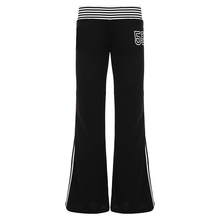 Flared joggebukse dame, svart med hvite sidestriper. Elegant, sporty fritidsbukse for vår og sommer.