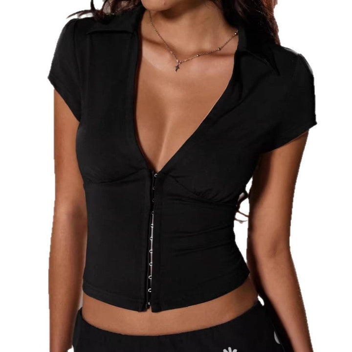 Dame bodysuit med elegant dyp V-hals i svart. Figurnær passform og lange ermer, perfekt for et stilig uttrykk.