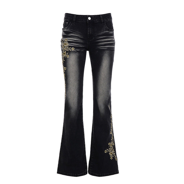Damejeans i flared stil med detaljert blomsterbroderi. Et elegant tillegg til enhver garderobe.