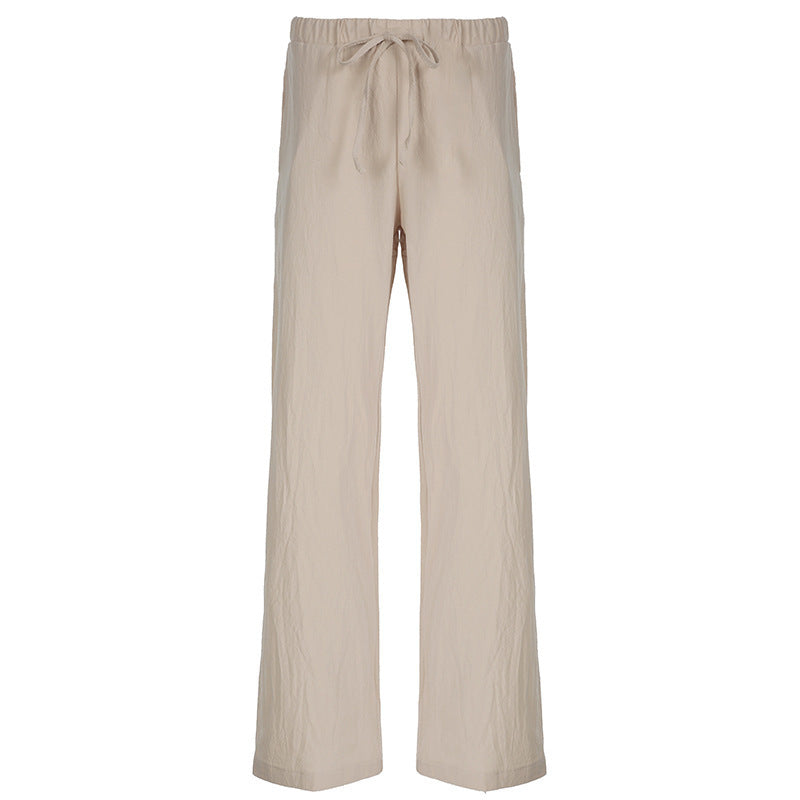 Trendy vide damebukser med justerbar midje og sidelommer, perfekt for en komfortabel og chic sommerlook.