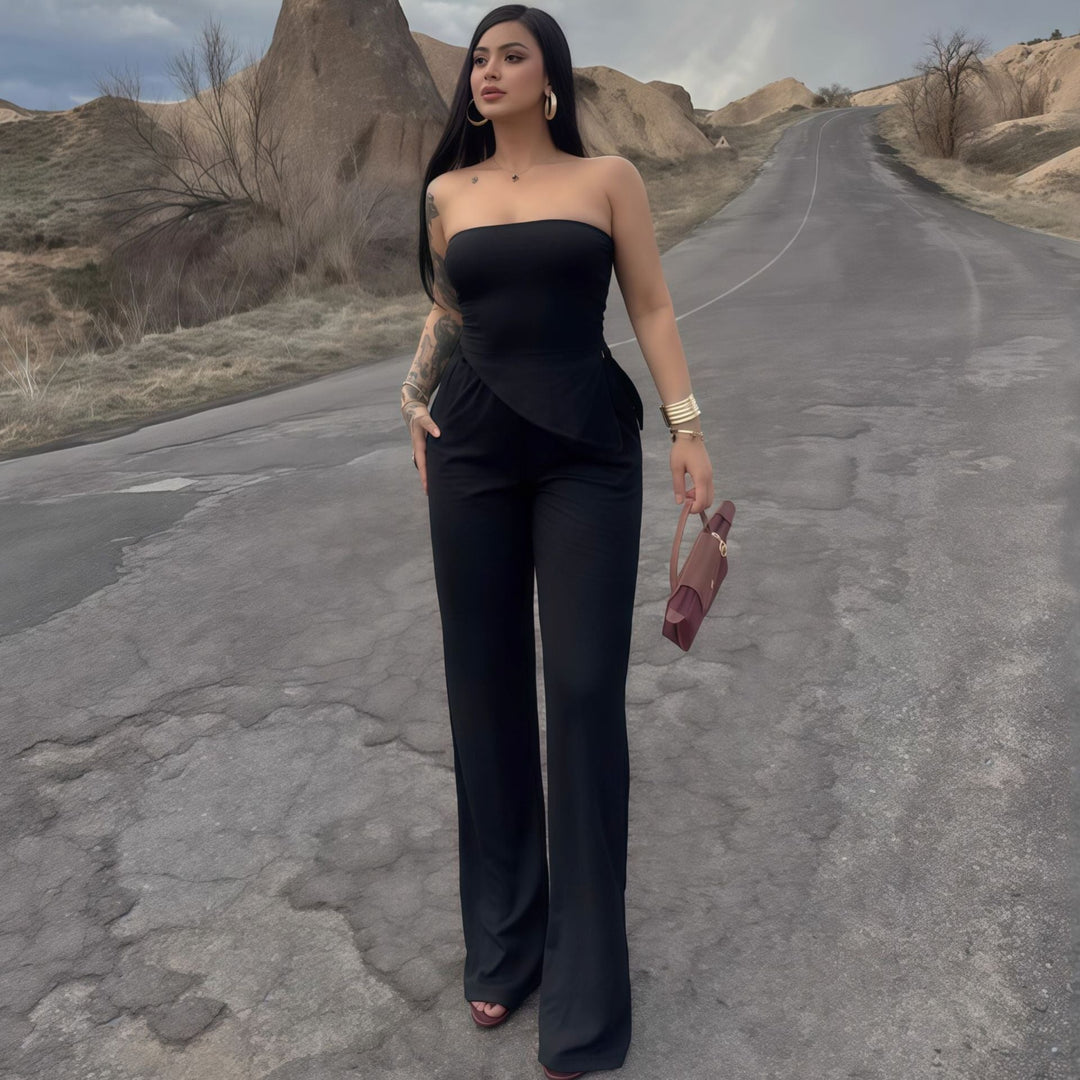 Elegant off-shoulder damejumpsuit med asymmetrisk kant, perfekt for fest og sommer.