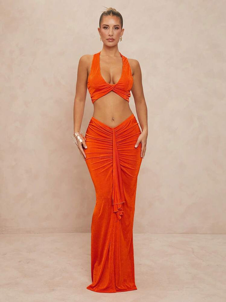 Trendy damesbodysuit med kryssrygg, sidesnitt og komfortabel passform, ideell for en moteriktig festlook.