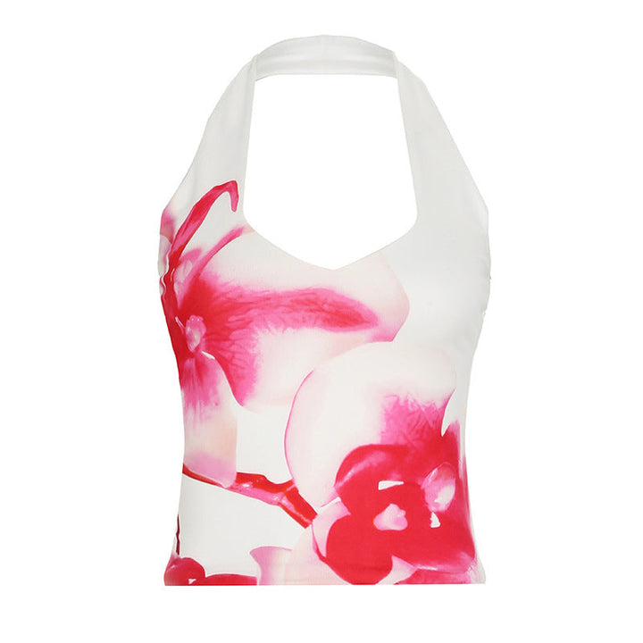 Trendy dame topp: hvit halterneck med detaljert blomsterdesign og dyp utringning. Elegant og casual stil.