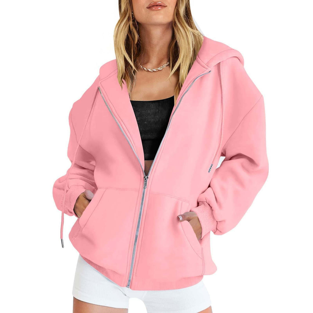 Stilfull oversized hettejakke for damer, med funksjonelle lommer. Perfekt for lag-på-lag.