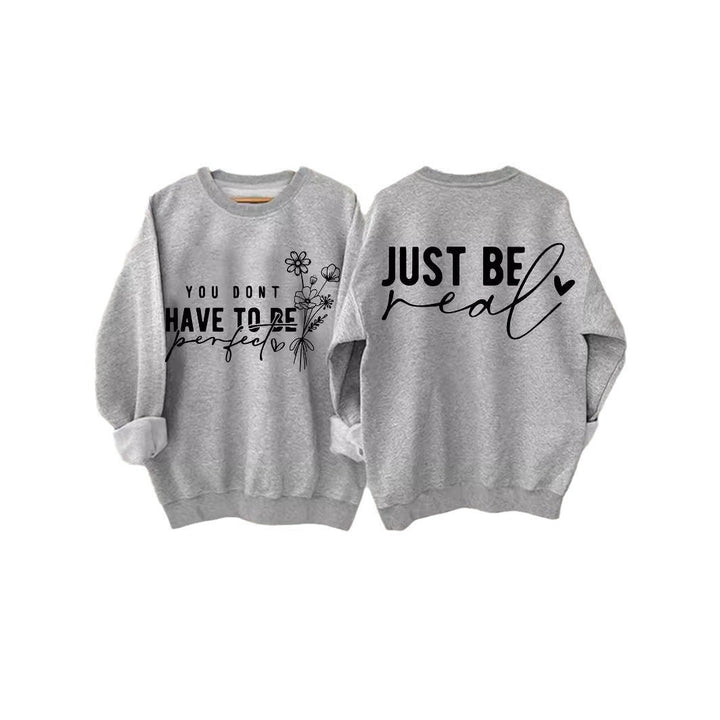 Avslappet passform damegenser med inspirerende skrift. En komfortabel pullover for kvinner.