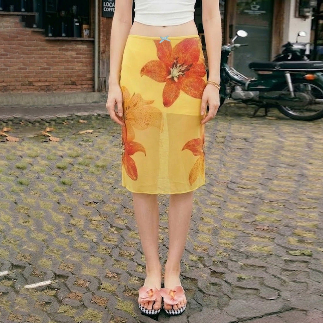 Elegant gult midi skjørt med blomsterprint, komfortabel elastisk midje for dame.
