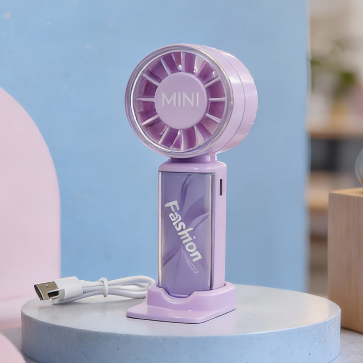 Elegant mini-vifte i hånden, gir umiddelbar frisk luft. Ditt bærbare kjølingsapparat for varmen.