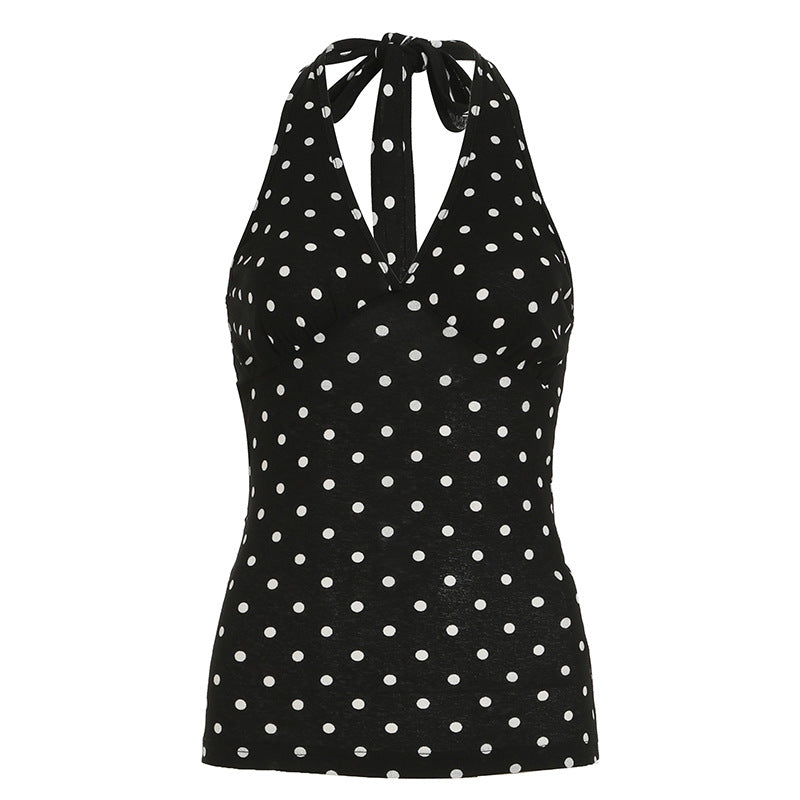 Mote-riktig halterneck topp for dame, med lekne prikker. Svart og hvit design passer til sommer og fest.