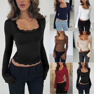 Elegant damebluse med lange ermer og delikate blonder, perfekt for hverdag og fest.