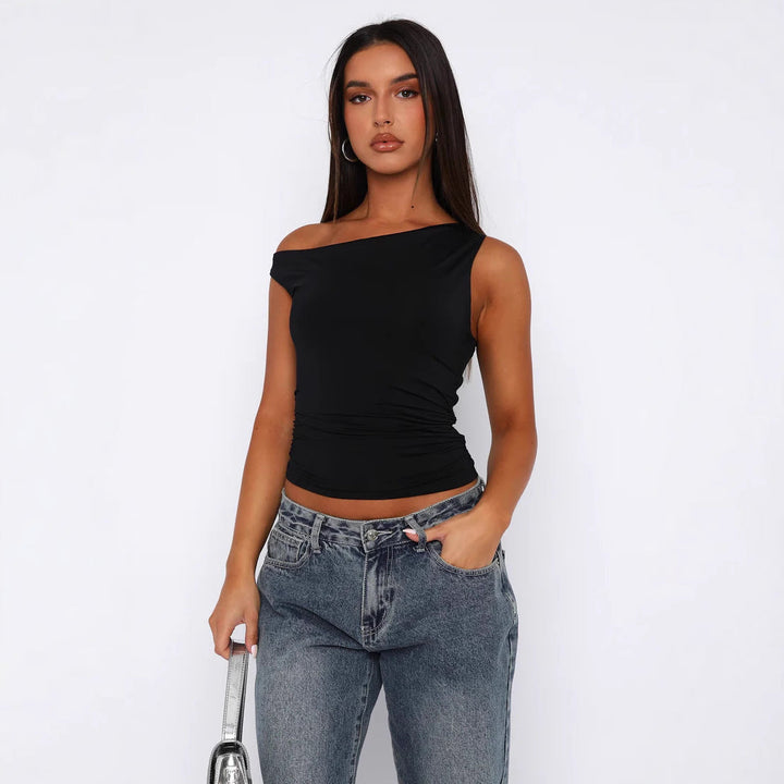 Dame off-shoulder crop-top med blomstermønster, perfekt for sommerlige dager og fest.