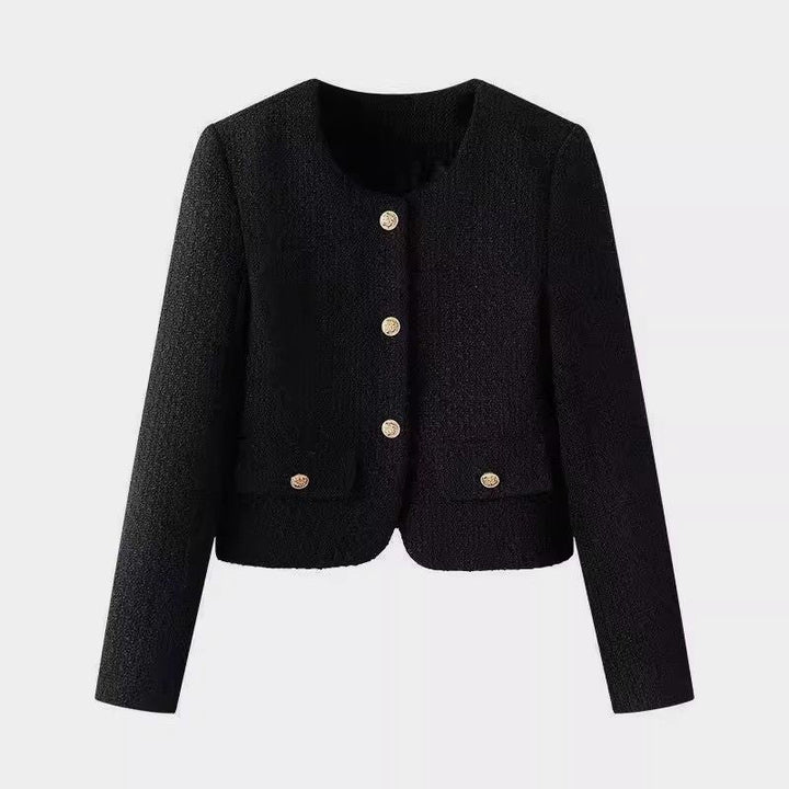 Elegant kort damejakke med raffinerte gullknapper, perfekt for motebevisste kvinner. En stilig vårjakke.