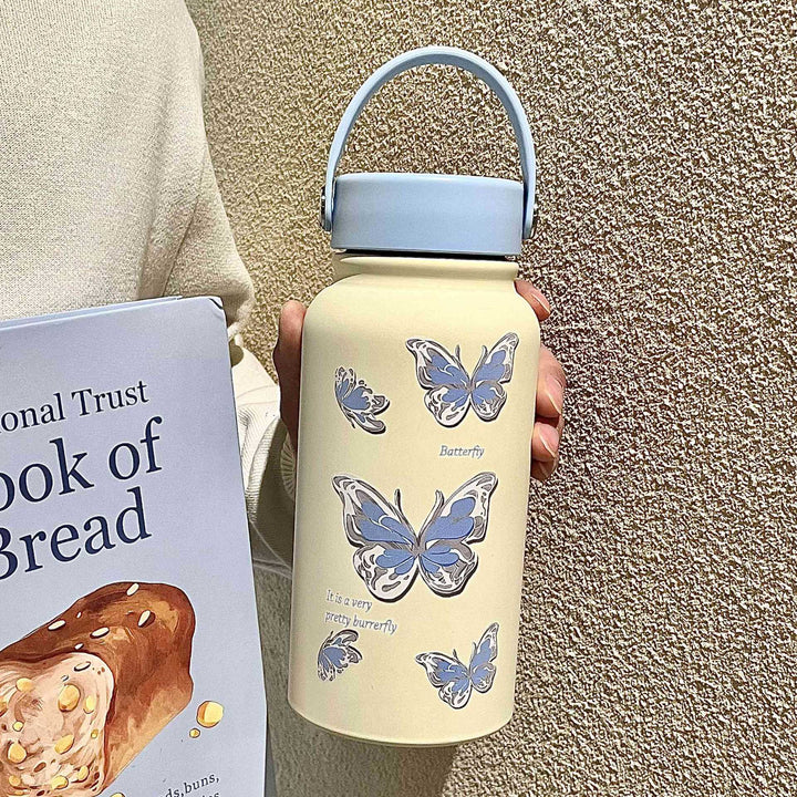 Blå isolert vannflaske i stål med tegneseriedesign. Perfekt termos for kalde/varme drikker, gjenbrukbar.