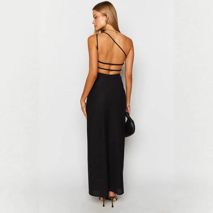 Allsidig svart dame maxikjole. Elegant festkjole eller chic sommerkjole med asymmetrisk halslinje.